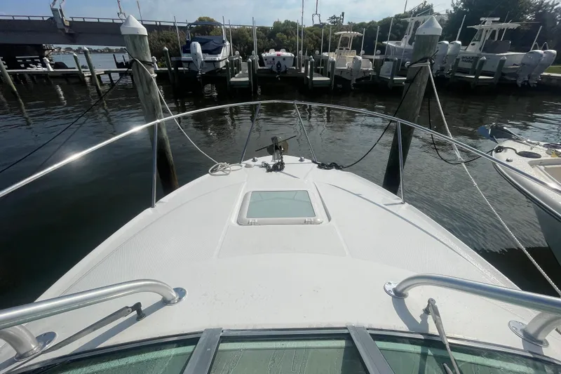 Slide: The Image of 2007 Wellcraft 252 Coastal boat docked at marina, view from bow. - 7