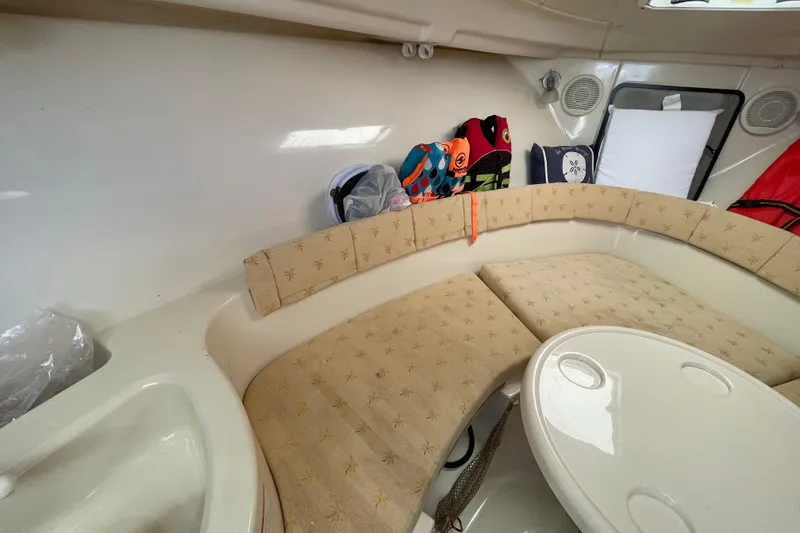 Slide: The Image of Interior of 2007 Wellcraft 252 Coastal boat with cushioned seating and table. - 9