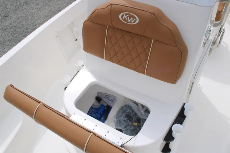 Slide: The Image of 2026 Key West 1720 Center Console boat seat with storage compartment open. - 12