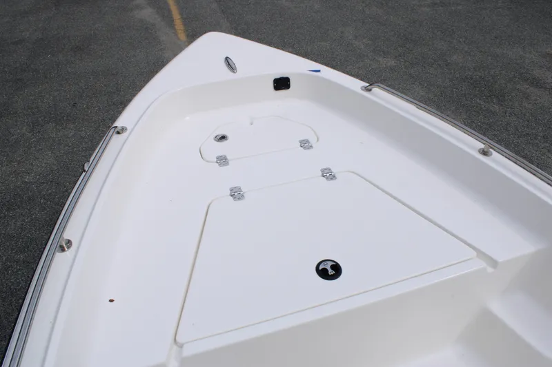 Slide: The Image of 2026 Key West 1720 Center Console boat deck, featuring storage compartments. - 14