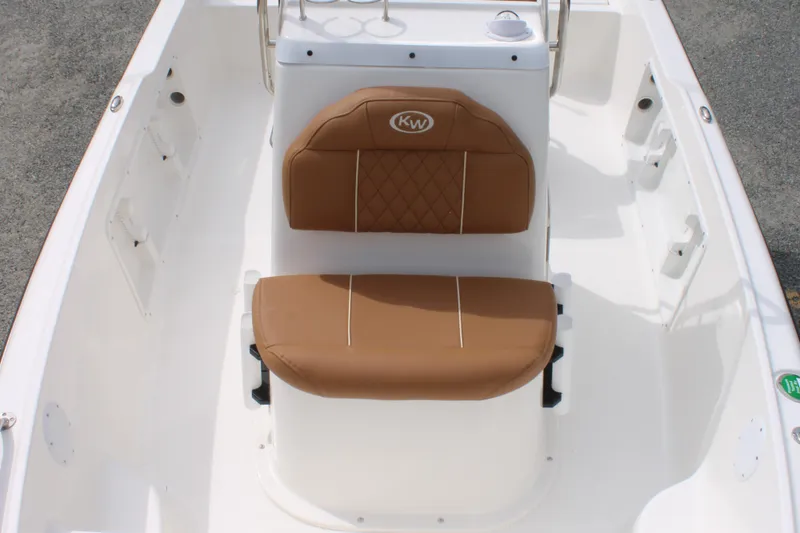 Slide: The Image of 2026 Key West 1720 Center Console boat with tan cushioned seating and white interior. - 17