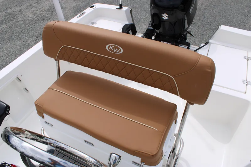 Slide: The Image of 2026 Key West 1720 Center Console boat with tan cushioned seating and Suzuki outboard motor. - 20
