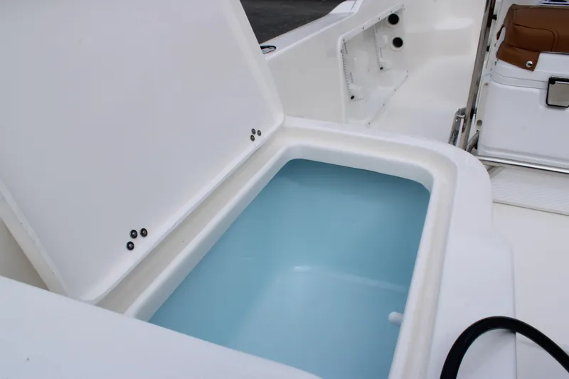 Slide: The Image of 2026 Key West 1720 Center Console boat with open storage compartment. - 26