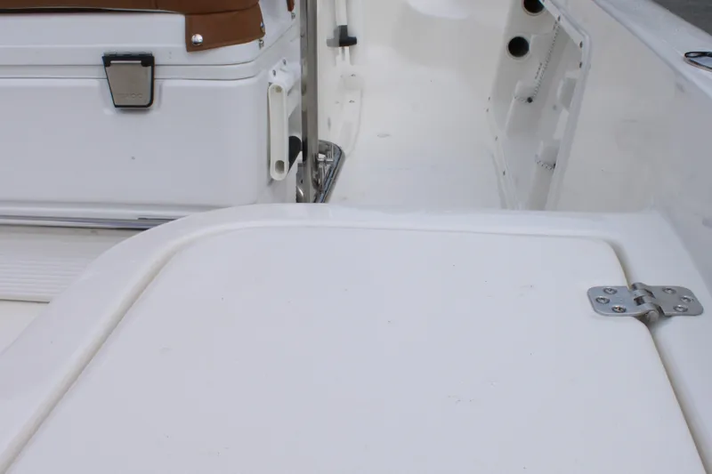 Slide: The Image of 2026 Key West 1720 Center Console boat interior with storage compartment and seating. - 27