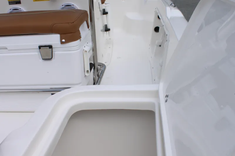 Slide: The Image of 2026 Key West 1720 Center Console boat interior with storage and seating. - 28