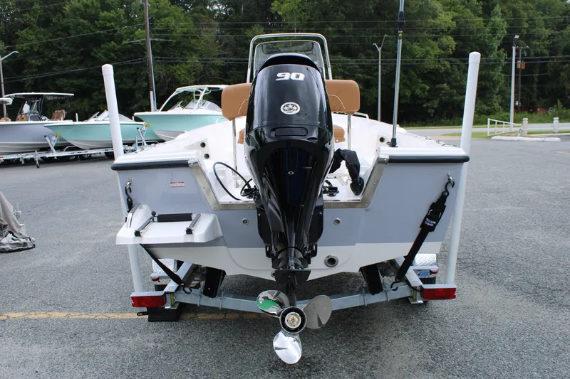 Slide: The Image of 2026 Key West 1720 Center Console boat with 90 HP engine, parked on trailer. - 3