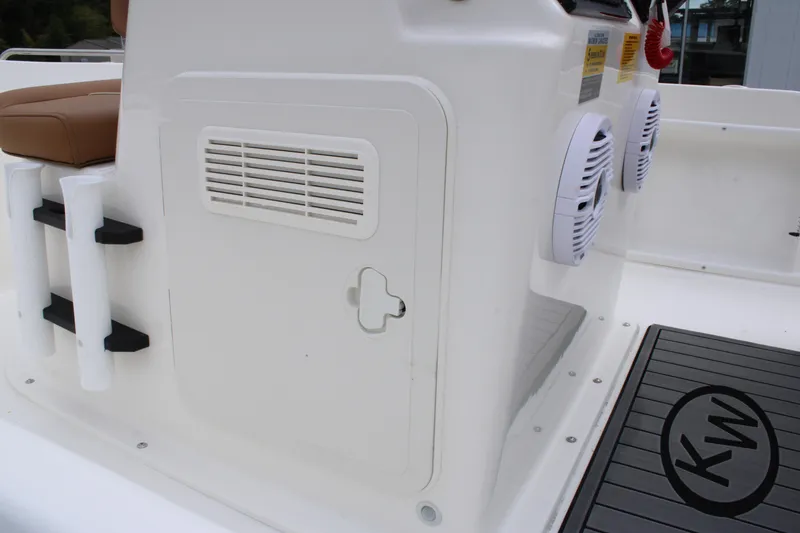 Slide: The Image of 2026 Key West 1720 Center Console boat interior with speakers and storage compartment. - 31