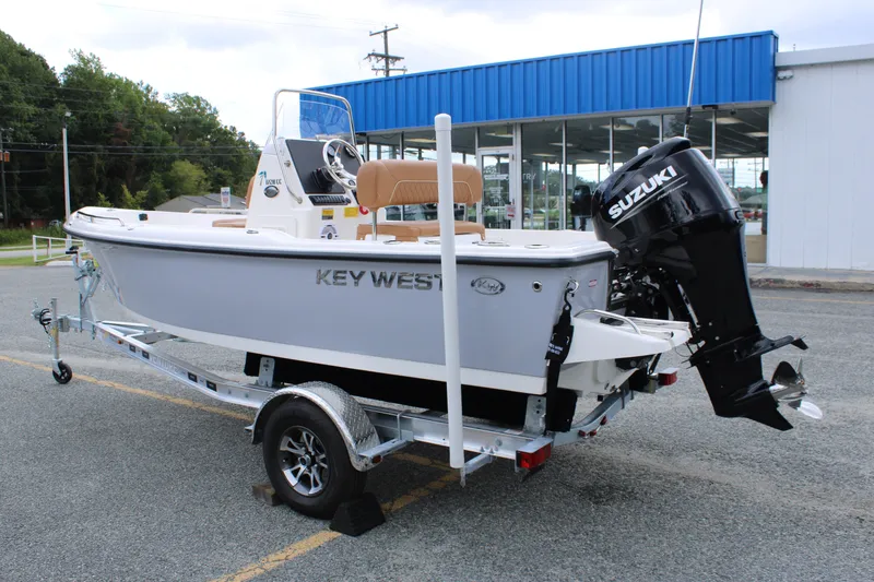 Slide: The Image of 2026 Key West 1720 Center Console boat on trailer, featuring Suzuki outboard motor. - 4
