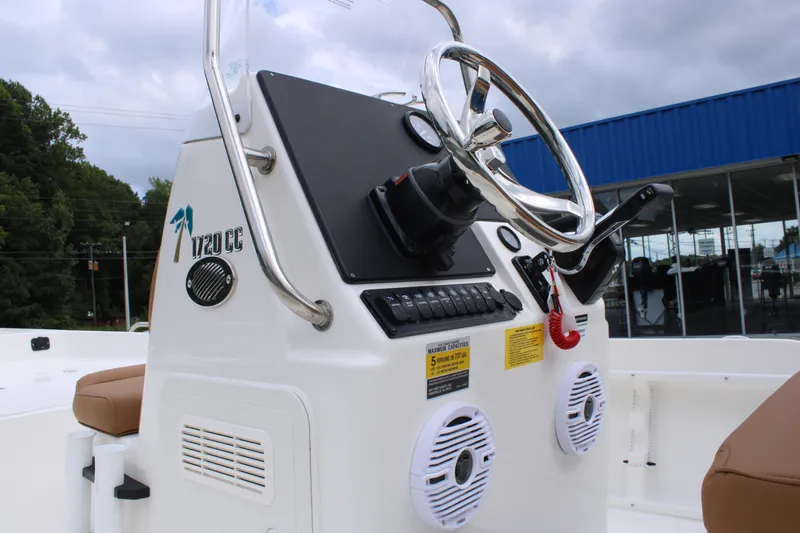 Slide: The Image of 2026 Key West 1720 Center Console boat dashboard with steering wheel and controls. - 8