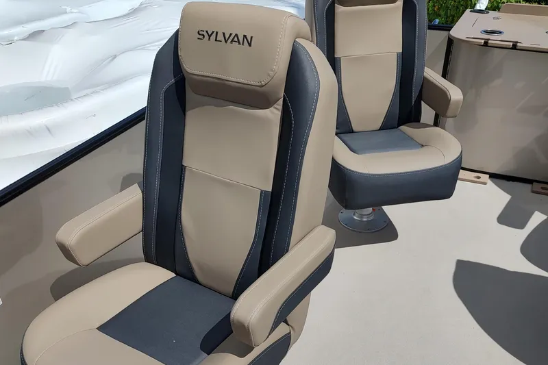Slide: The Image of 2026 Sylvan Mirage X3 Party Fish boat dashboard with steering wheel and controls. - 14