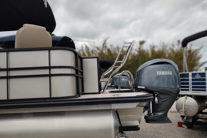 Slide: The Image of Extended deck with ski tow bar and Yamaha outboard off back of pontoon boat - 26