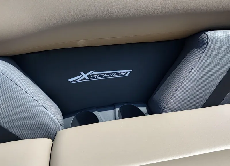 Slide: The Image of 2026 Sylvan Mirage X3 Party Fish pontoon boat on trailer, displayed outdoors. - 3