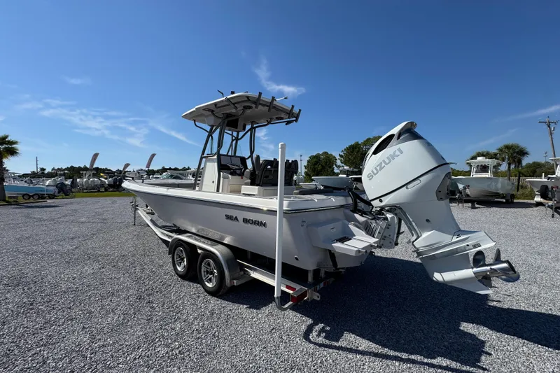 Slide: The Image of 2022 Sea Born FX25 Bay boat with Suzuki engine on trailer, parked outdoors. - 15