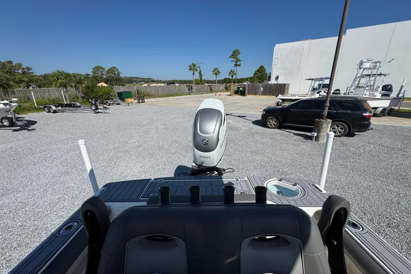 Slide: The Image of 2022 Sea Born FX25 Bay boat with Suzuki engine in a parking lot. - 28