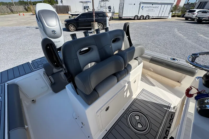Slide: The Image of 2022 Sea Born FX25 Bay boat interior with seating and steering wheel. - 33