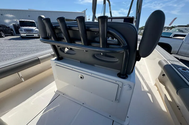 Slide: The Image of 2022 Sea Born FX25 Bay boat interior with rod holders and seating. - 34