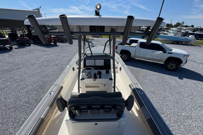 Slide: The Image of 2022 Sea Born FX25 Bay boat interior with steering console and rod holders. - 35