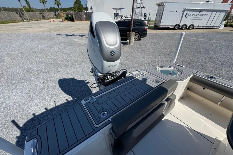 Slide: The Image of 2022 Sea Born FX25 Bay boat with Suzuki 350 outboard engine, parked outdoors. - 38
