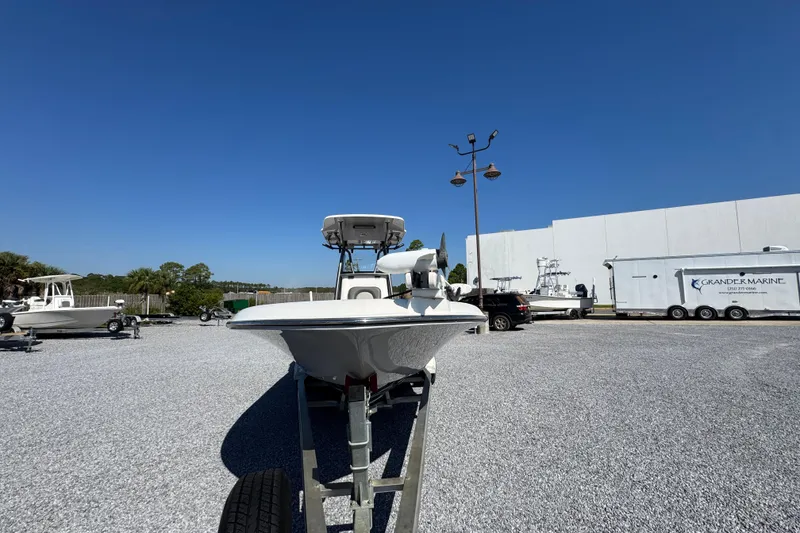 Slide: The Image of 2022 Sea Born FX25 Bay boat on trailer in outdoor lot. - 5