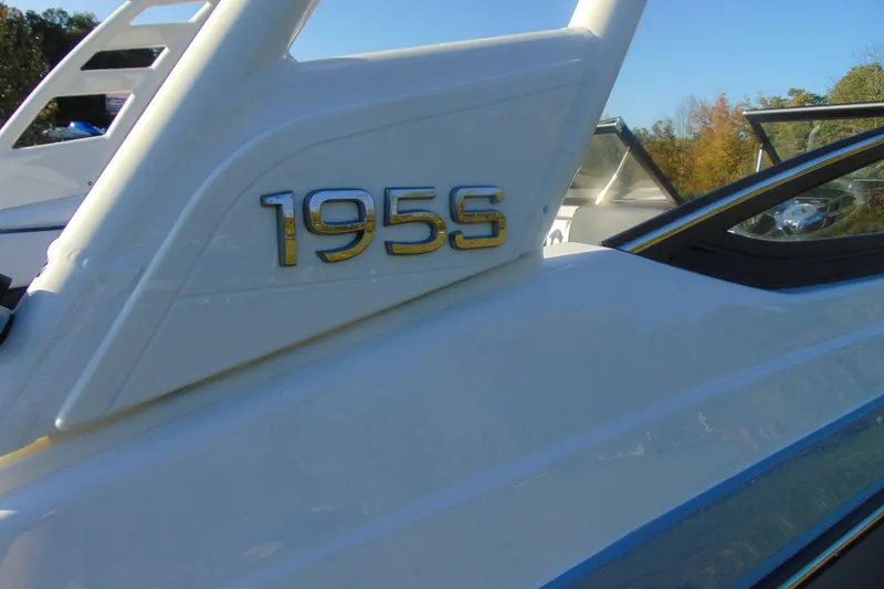 Slide: The Image of 2026 Yamaha Boats 195S model emblem on sleek white surface. - 14
