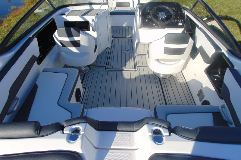 Slide: The Image of Interior of 2026 Yamaha Boats 195S, featuring sleek seating and modern dashboard design. - 17