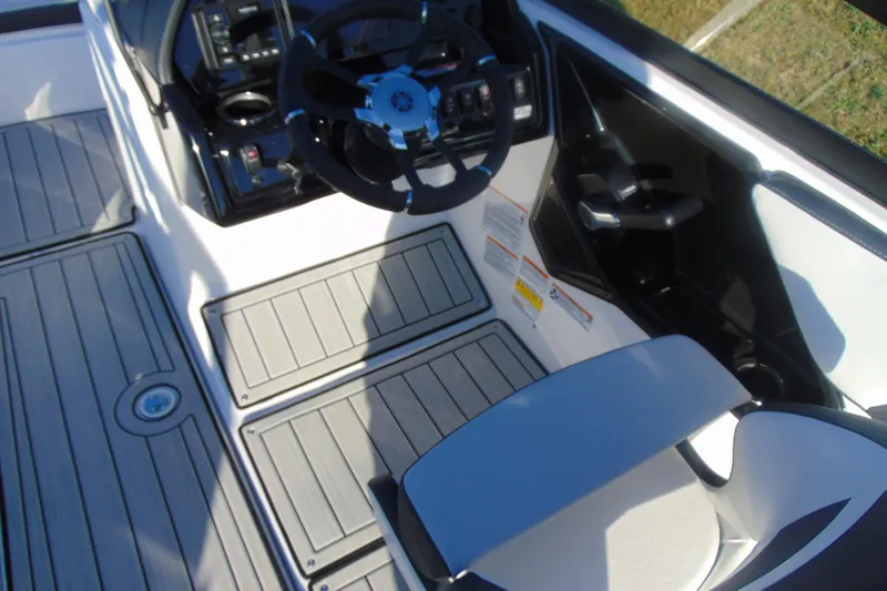 Slide: The Image of 2026 Yamaha Boats 195S cockpit with steering wheel and control panel. - 19