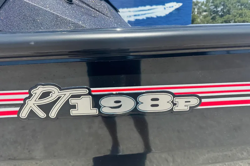Slide: The Image of 2025 Ranger RT188P boat with red and white stripes, close-up view. - 8
