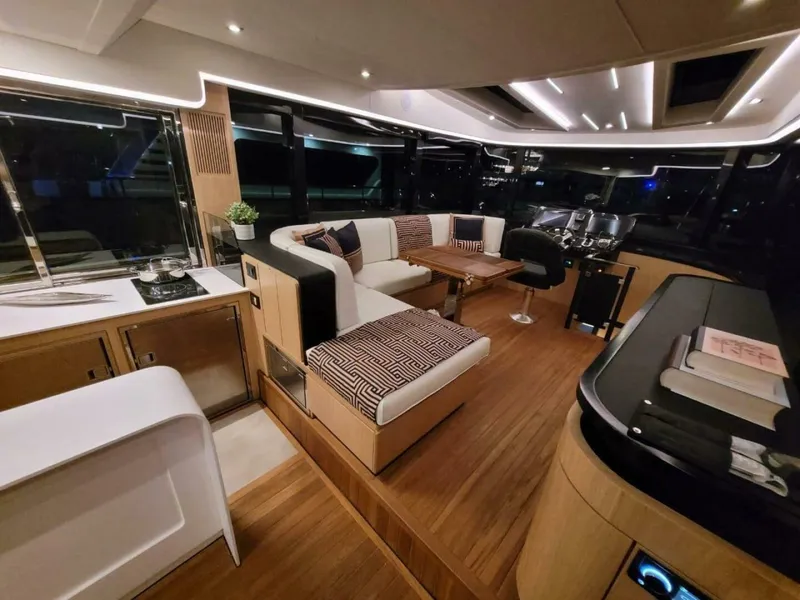 Slide: The Image of Luxurious interior of 2025 OKEAN 52 yacht with modern seating and elegant lighting. - 13