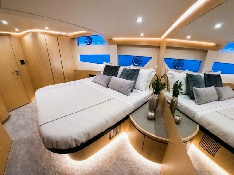 Slide: The Image of Luxurious bedroom interior of 2025 OKEAN 52 yacht with modern design and ambient lighting. - 26