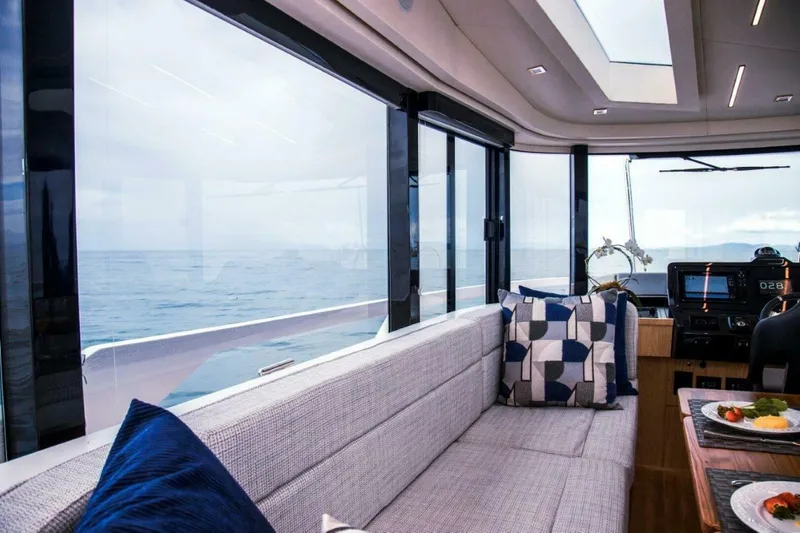 Slide: The Image of Luxurious interior of 2025 OKEAN 52 yacht with ocean view and modern seating. - 30