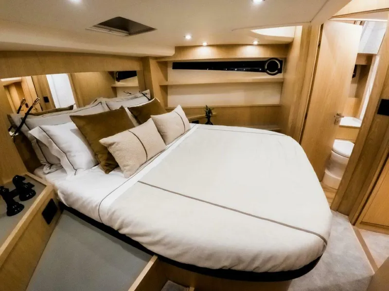 Slide: The Image of Luxurious cabin interior of 2025 OKEAN 52 yacht with modern design and cozy bedding. - 34