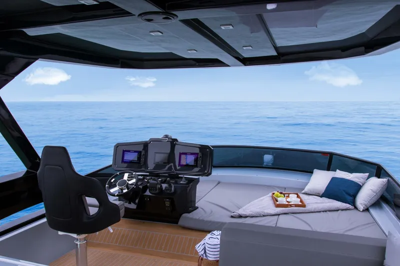 Slide: The Image of Luxurious 2025 OKEAN 52 yacht interior with helm, seating, and ocean view. - 4