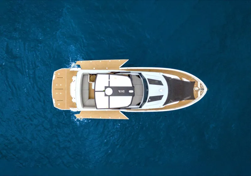 Slide: The Image of Top view of 2025 OKEAN 52 yacht cruising on blue ocean waters. - 46