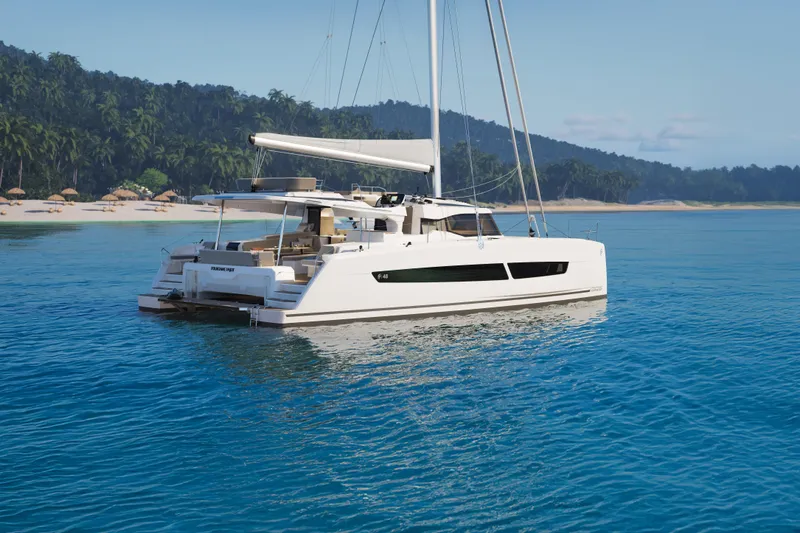 Slide: The Image of 2026 Fountaine Pajot 48 catamaran sailing near tropical beach with lush greenery. - 38