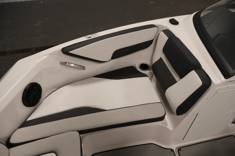 Slide: The Image of 2026 Yamaha Boats AR195 interior seating with sleek black and white upholstery design. - 13