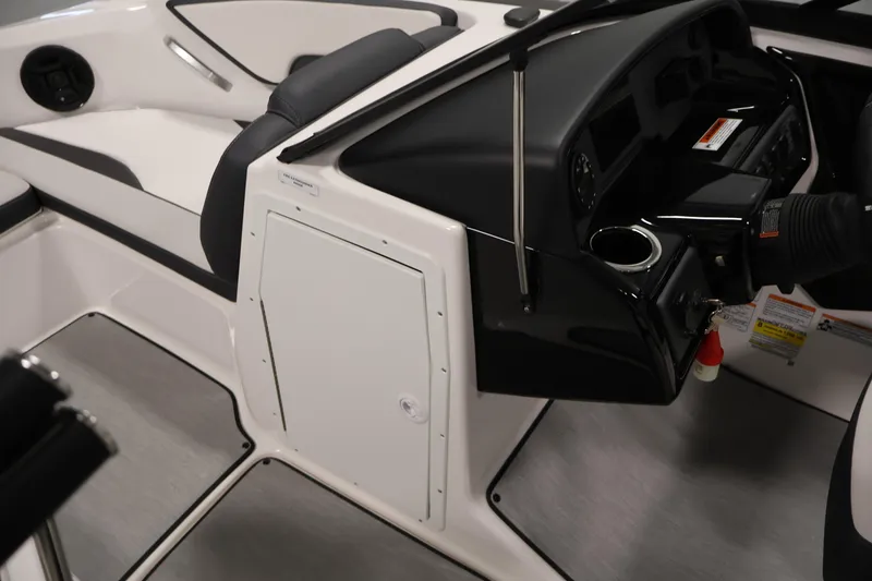Slide: The Image of Interior of 2026 Yamaha Boats AR195, featuring sleek black and white design elements. - 15