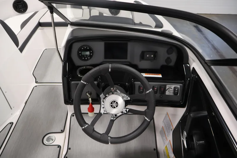 Slide: The Image of 2026 Yamaha Boats AR195 dashboard with steering wheel and control panel. - 18