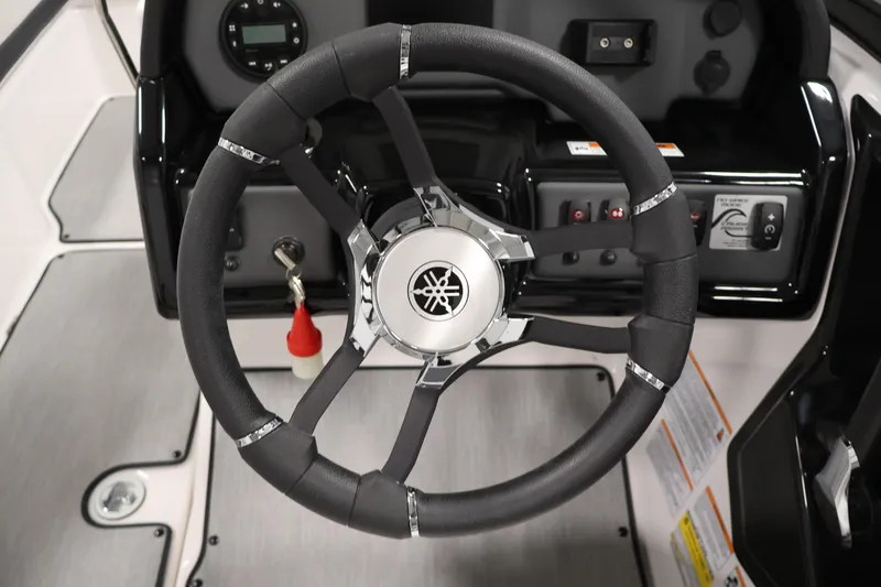 Slide: The Image of Steering wheel of 2026 Yamaha Boats AR195, featuring sleek design and modern controls. - 19
