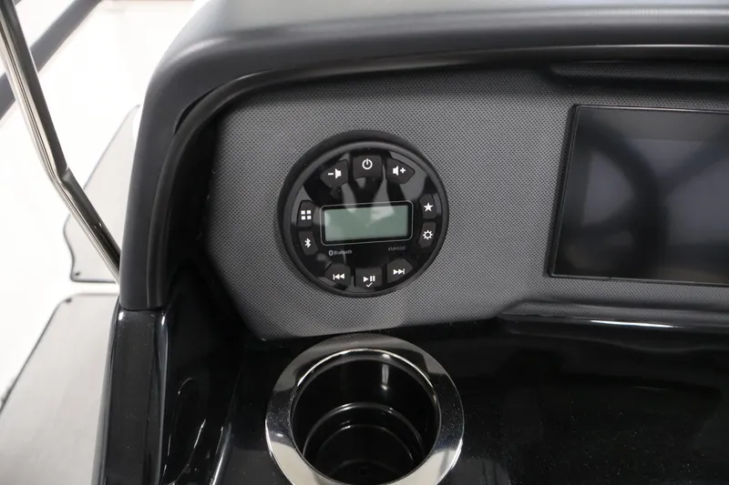 Slide: The Image of 2026 Yamaha Boats AR195 dashboard with control panel and cup holder. - 20