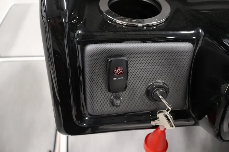 Slide: The Image of Control panel of 2026 Yamaha Boats AR195 with blower switch and ignition keys. - 23
