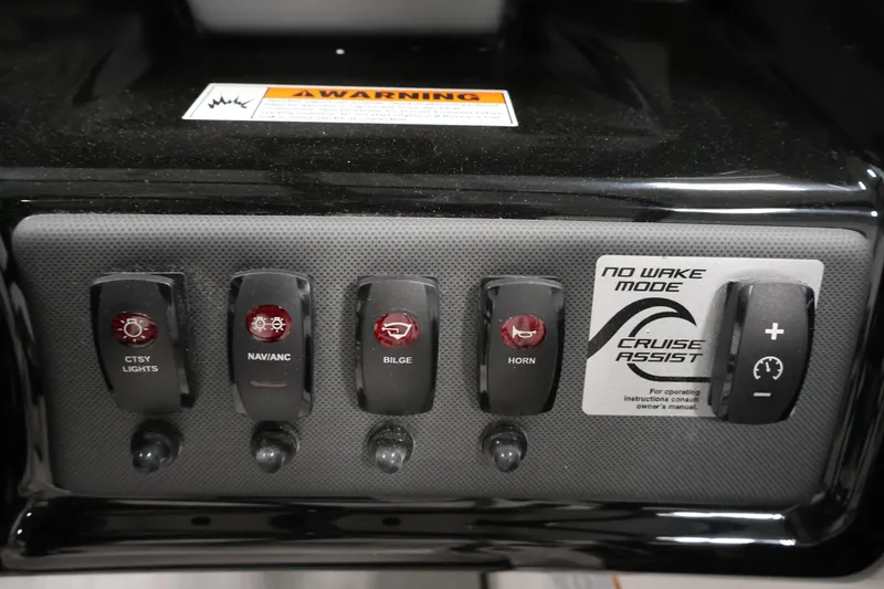 Slide: The Image of Control panel of 2026 Yamaha Boats AR195 featuring various switches and cruise assist mode. - 24