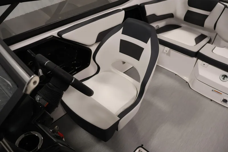 Slide: The Image of Interior of 2026 Yamaha AR195 boat with modern seating and steering wheel. - 25