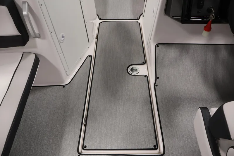 Slide: The Image of Interior view of 2026 Yamaha Boats AR195, featuring sleek flooring and seating. - 27