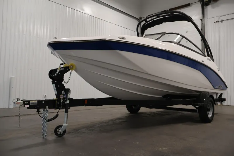 Slide: The Image of 2026 Yamaha Boats AR195 on trailer in indoor showroom setting. - 35
