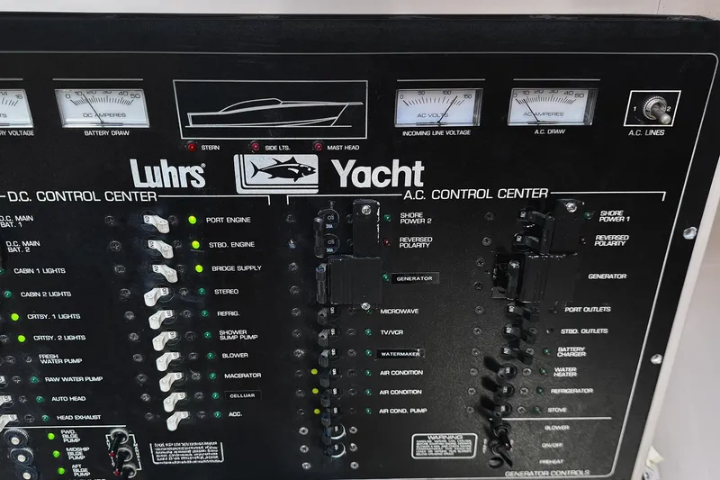 Slide: The Image of Control panel of a 1994 Luhrs 38 yacht, featuring AC and DC systems. - 30