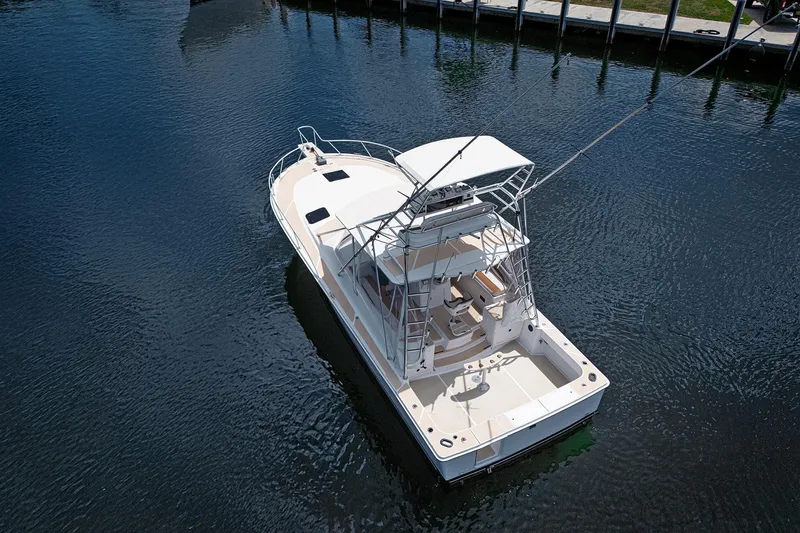 Slide: The Image of 1994 Luhrs 38 boat on calm water, aerial view. - 7
