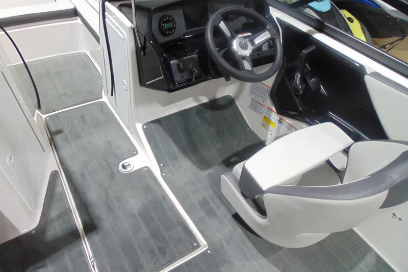 Slide: The Image of 2026 Yamaha Boats AR190 interior with steering wheel and seating. - 11