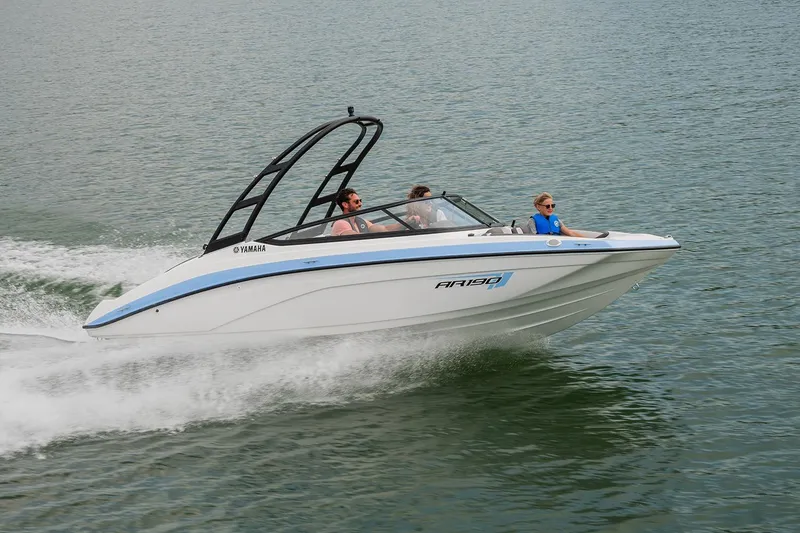 Slide: The Image of 2026 Yamaha Boats AR190 displayed indoors on a trailer. - 3