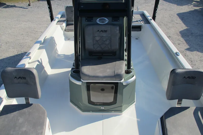 Slide: The Image of 2026 Avid 23 Fusion boat interior with seating and console, showcasing modern design. - 16