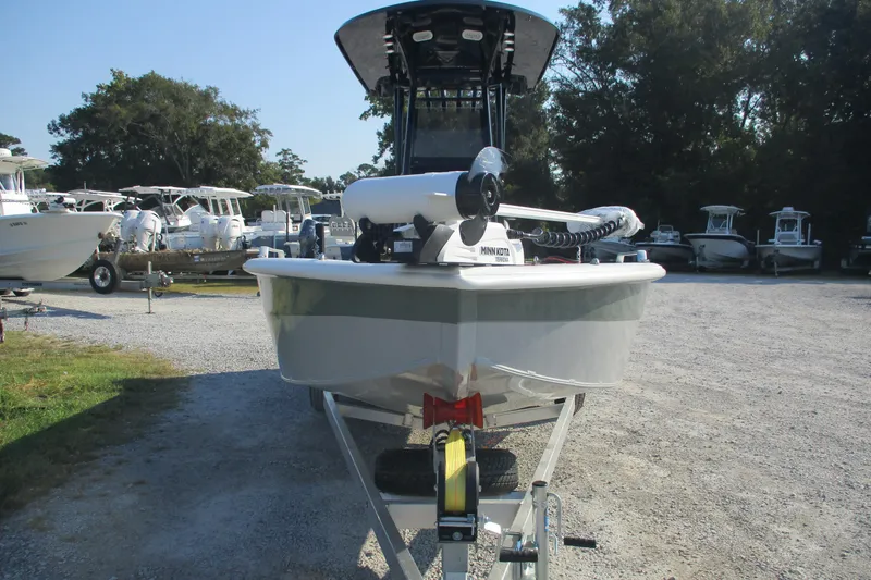 Slide: The Image of 2026 Avid 23 Fusion boat on trailer in outdoor dealership lot. - 2